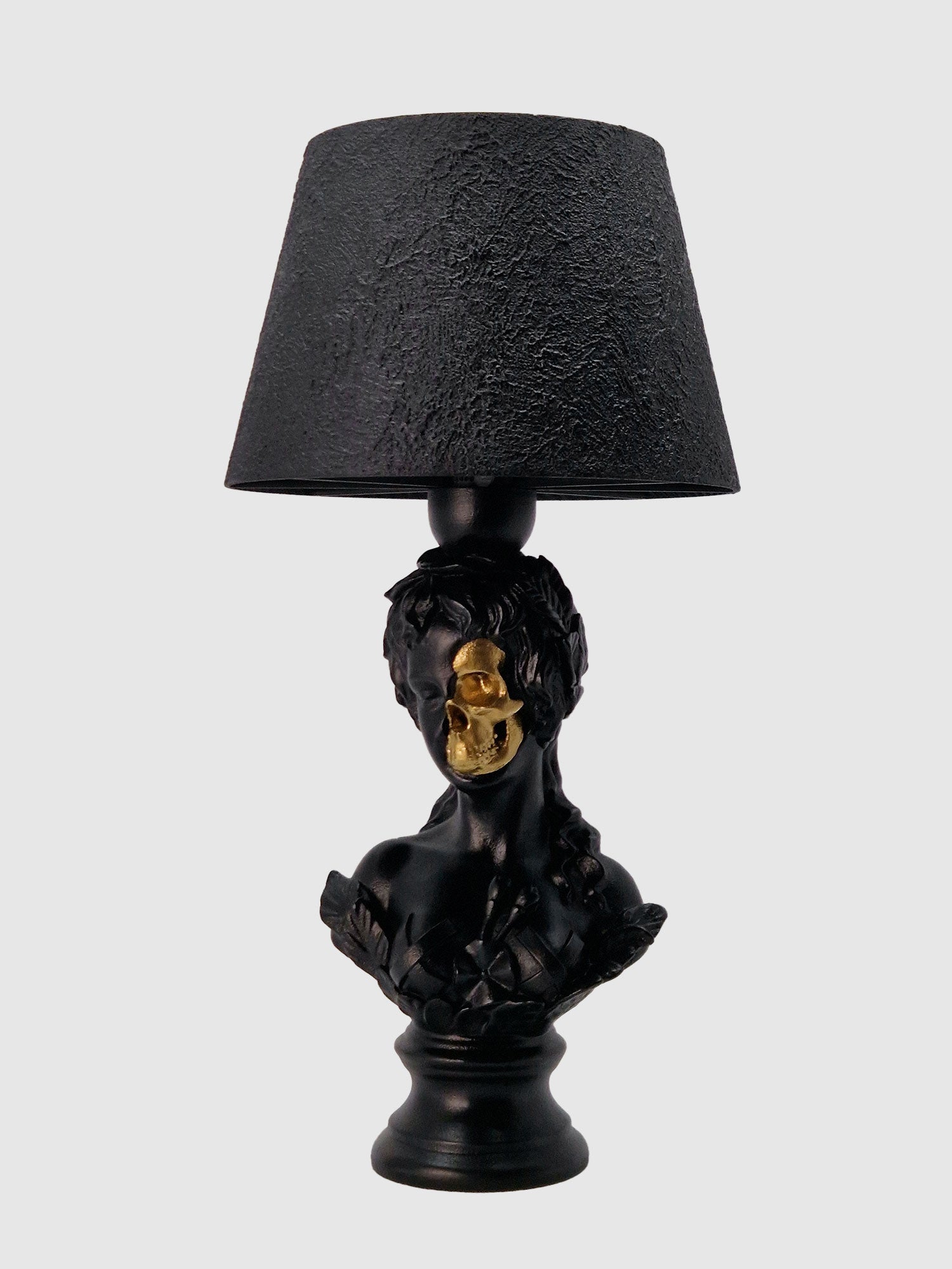 Angled front view of the Venus bust lamp, showing the transition from classical face to anatomical skull, designed by Horror Romance.