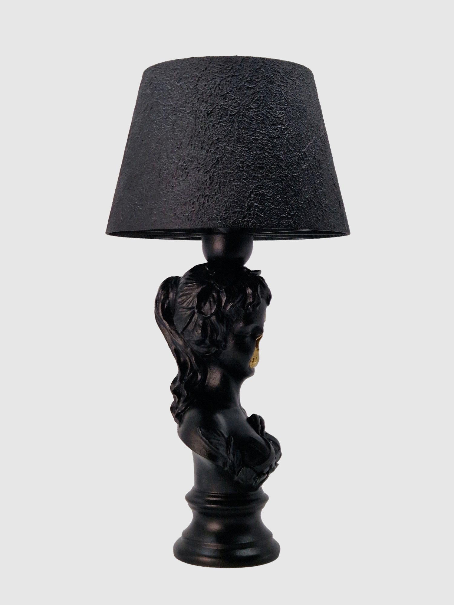 Side profile of the Venus bust lamp highlighting the textured cylinder shade and matte black finish, created by Horror Romance.
