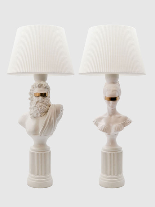 A symmetrical set of Blind Zeus and Hera white and gold classical bust lamps with matching white shades.