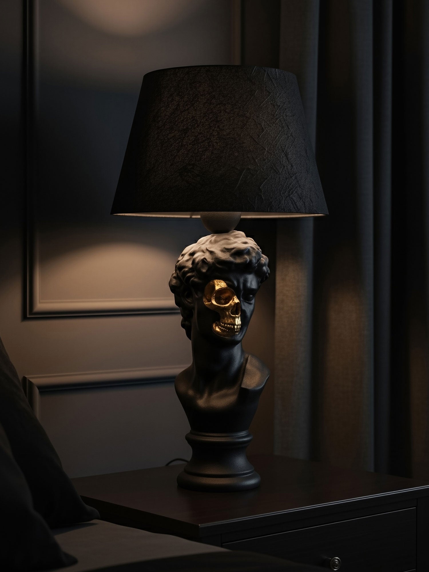 Lifestyle shot of the David half-skull lamp on a mahogany nightstand in a moody, upscale gothic bedroom designed and manufactured by Horror Romance.