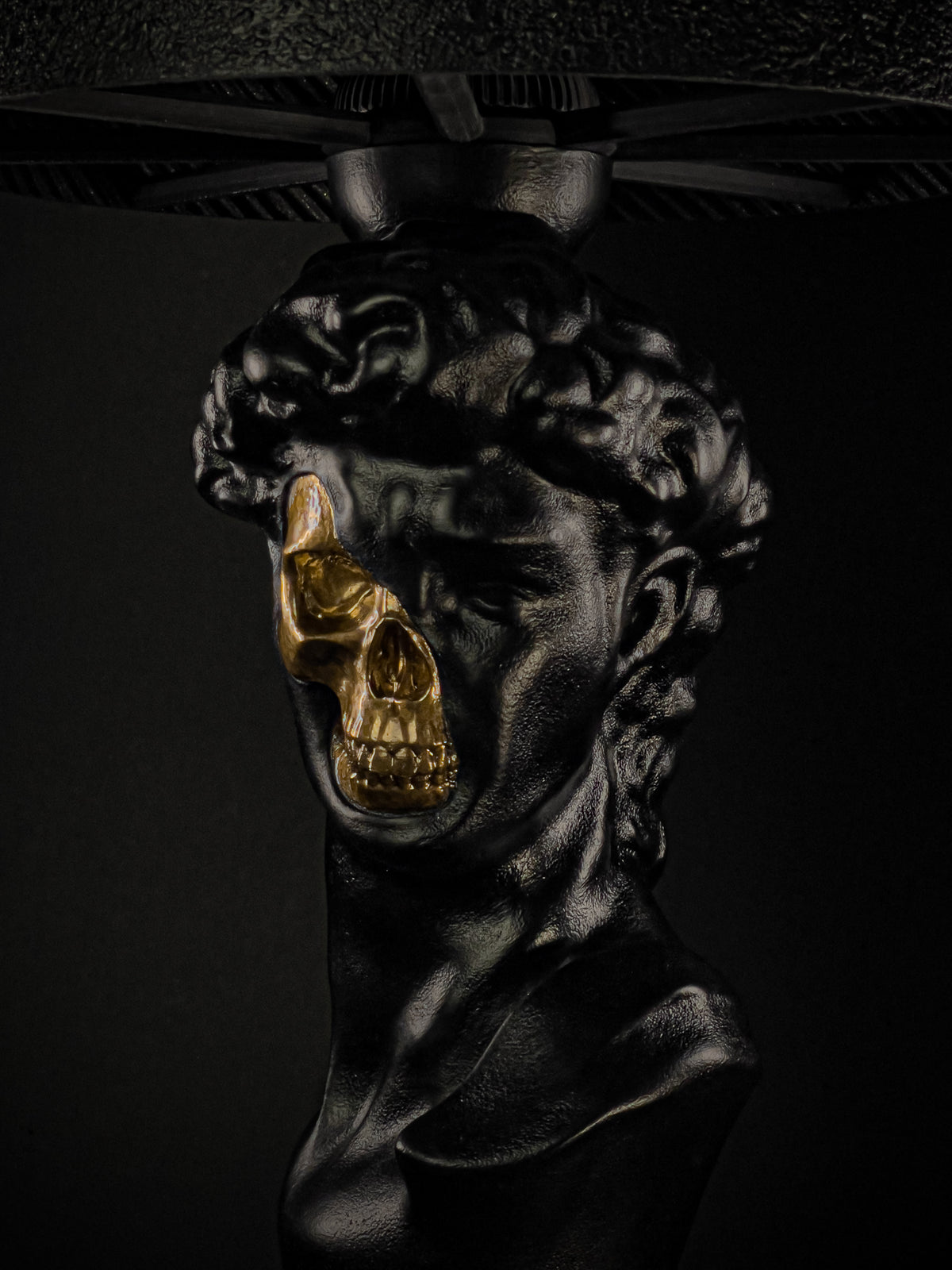 Detail of the David lamp’s exposed skull and mineral surface