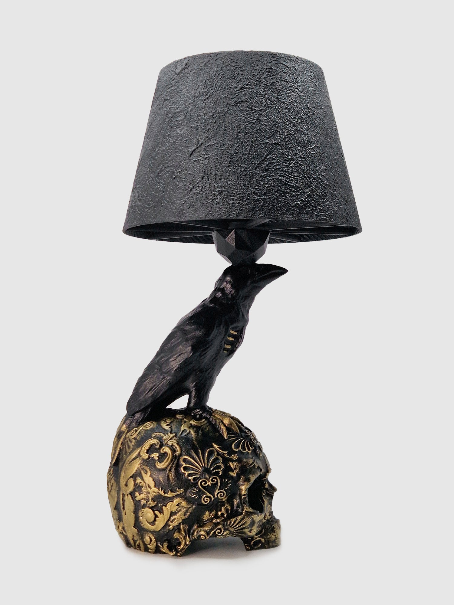 Profile silhouette of the Raven Skull lamp, emphasizing the elegant curve of the raven and the skull details designer Horror Romance studio.