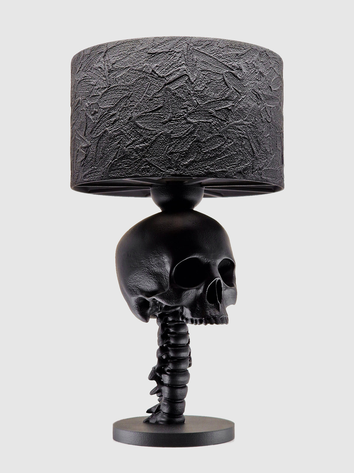 Skull Spine Lamp from Horror Romance, a black gothic lamp with skull and spine base on a white background.
