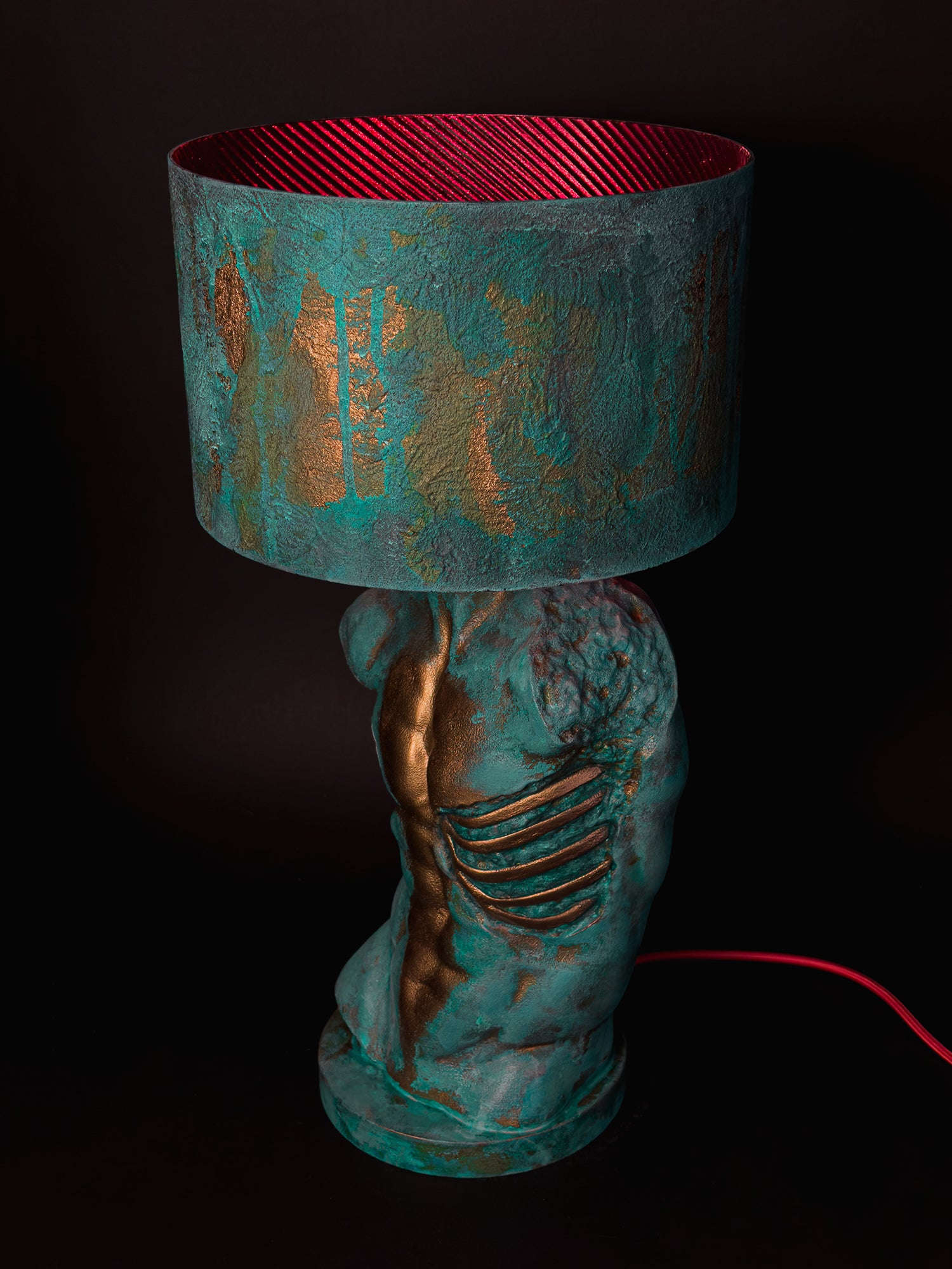 High-angle side view of Verdigris Body Adam showing exposed ribs, red shade lining and red cable