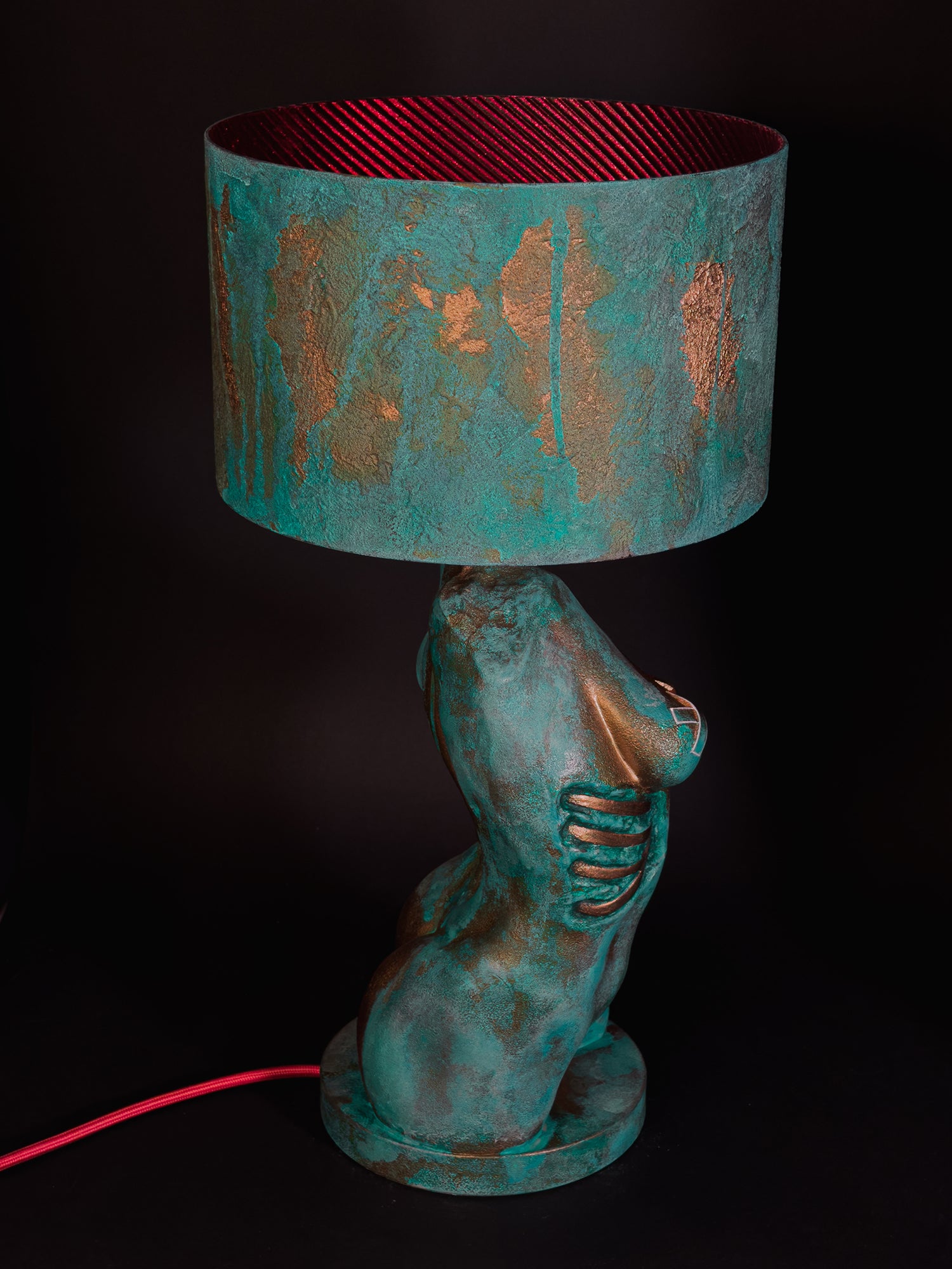 High-angle side view of Verdigris Body Eve showing exposed ribs, red shade lining and red cable