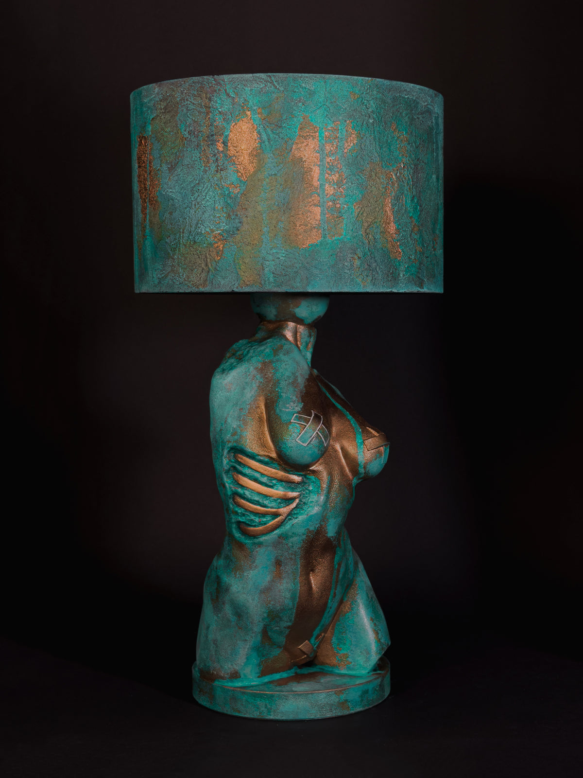 Side view of Verdigris Body Eve showing exposed sculpted ribs and turquoise copper patina