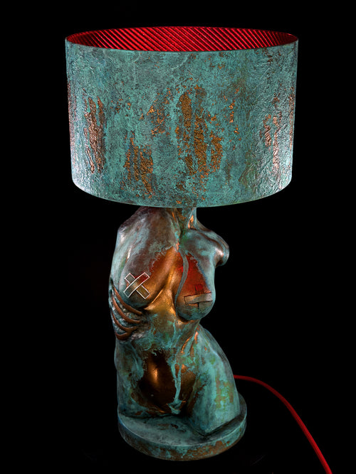 Illuminated Verdigris Body torso lamp with turquoise patina and red-lined shade
